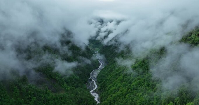 Aerial footage of beautiful high altitude grassland and mountain landscape	