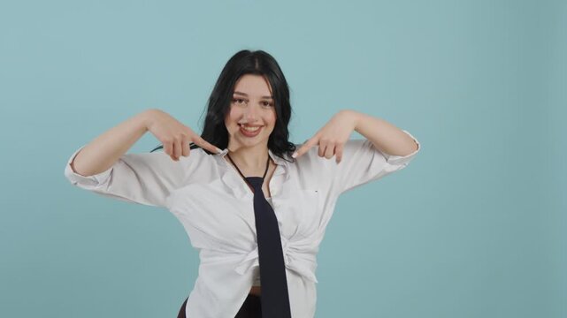 Confident young woman pointing fingers at herself with a proud smile