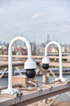 Surveillance Cameras and Midtown Manhattan as seen from Brooklyn Bridge, New York City, USA