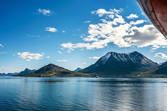 Landscape in Norway with a boat, seen from a ship