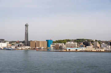 Naklejka premium Shimonoseki city skyline and harbor waterfront featuring the iconic Kaikyo Yume Tower, Japan