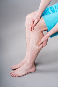 Calf muscle cramped, massage of male leg