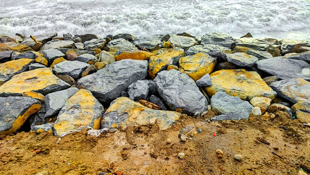 Ocean Waves Crashing Against Coastal Breakwater Rocks