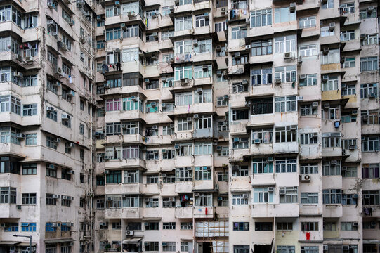 Dense full-frame facade of the famous overcrowded residential Monster Building complex in Quarry Bay, Hong Kong