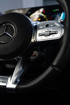 Mercedes Benz A35 AMG steering wheel controls close up, Premium hot hatch interior drive mode dial detail