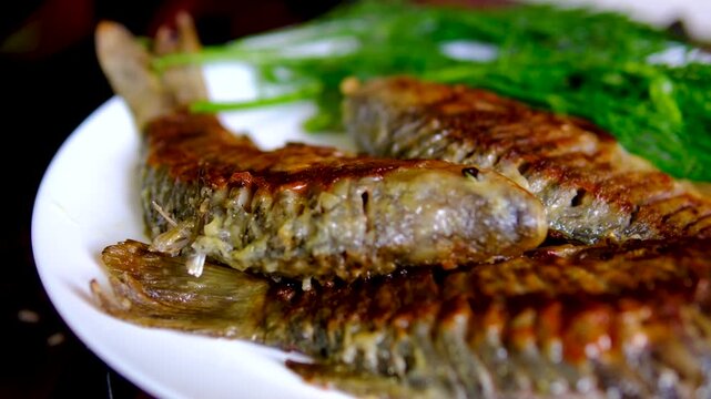 Traditional fried crucian carp recipe from cleaning and seasoning to pan frying and serving homemade fish meal step by step cooking process. full cycle of cooking fresh crucian carp