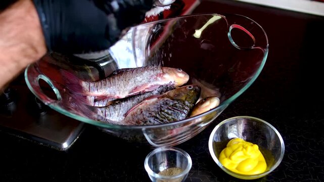 Traditional fried crucian carp recipe from cleaning and seasoning to pan frying and serving homemade fish meal step by step cooking process. full cycle of cooking fresh crucian carp