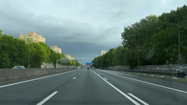 Amsterdam Netherlands highway, Empty urban highway beneath storm clouds