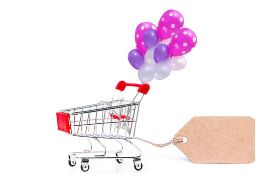 shopping cart with blank paper tag label isolated on white.