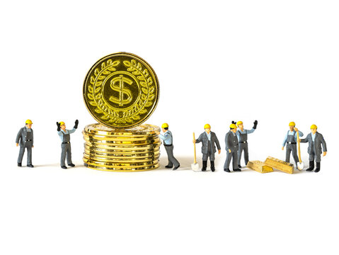 Golden coins and miniature workers man isolated on white background.