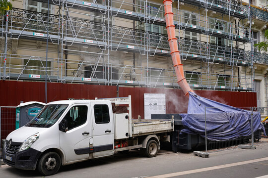 VICHY, FRANCE - JUNE 11, 2026: Renovation works on a historic building facade with scaffolding and construction truck