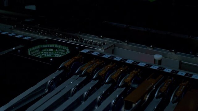 Close-up of high-speed machine assembling micro components with optical inspection flashes. Robotic arm precision. Smart factory automation, industrial engineering and hardware tech
