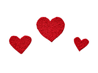 Obraz premium Three textured red felt fabric heart shapes in different sizes on a transparent background