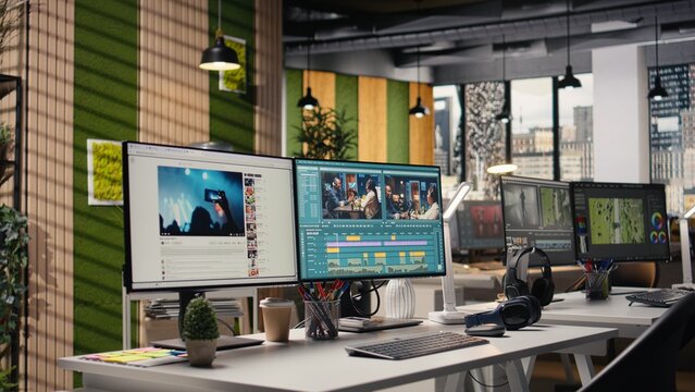 Studio with no people shows PC with advanced video editing software, interface displays recorded footage with sync tools and toolbar panels for adjustments, creative post production process.