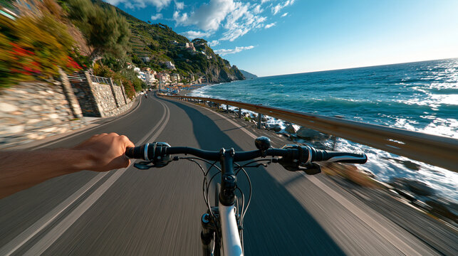 Cycler journeys through breathtaking coastal views along winding roads