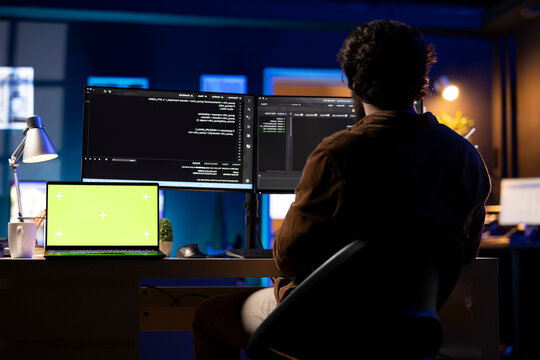 Programmer designing and developing software applications using isolated screen laptop. IT professional implementing and maintaining company systems using mockup notebook.
