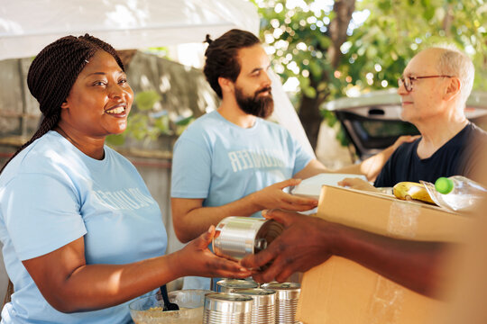 And volunteers provide aid, giving donation boxes filled with non-perishable items to the poor.