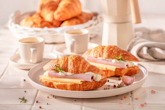 Hot and tasty french croissant for quick lunch.