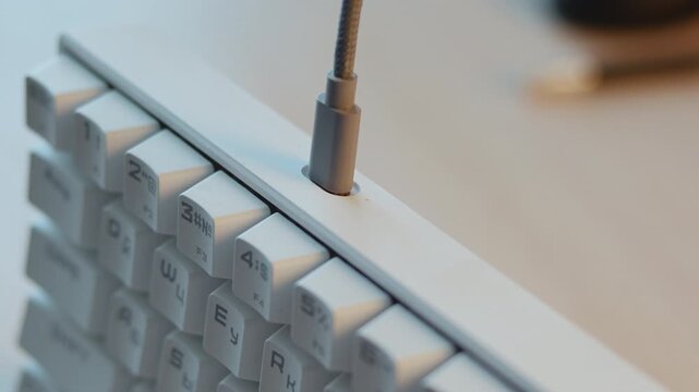 Scene Showing Detailed Connection Of Cable Into Mechanical Keyboard For Workspace Customization . Media