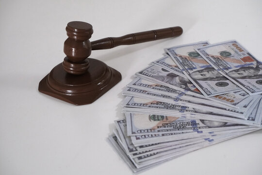 Court hammer and dollar on document. Bribery concept. Document forgery
