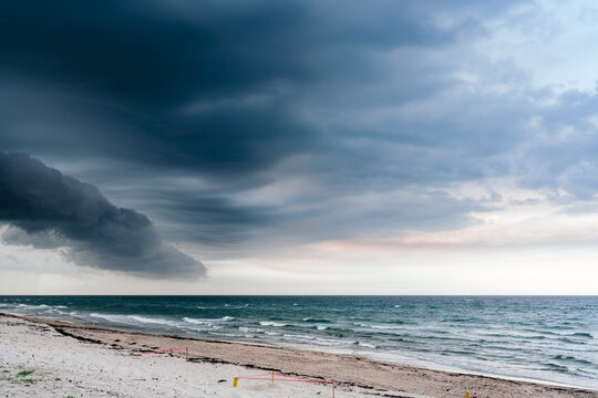 storm clouds over beach and ocean
