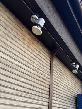 Closed store shutter with spotlight