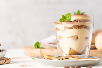 Elegant Tiramisu Dessert in Glass Cups with Mint © anammarques
