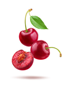 Red cherries with half cut isolated on white background.