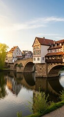 Obraz premium Historic Timber Framed Buildings Reflected in River with Stone Bridge.