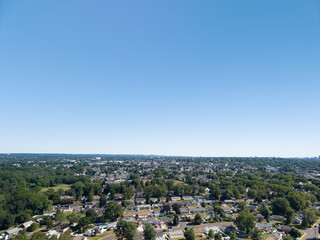 Obraz premium Aerial view showing residential suburbia and blue sky