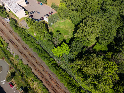 Aerial view showing industrial zone next to railroad tracks
