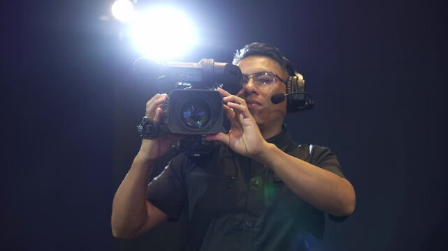 Professional camera operator filming in a studio