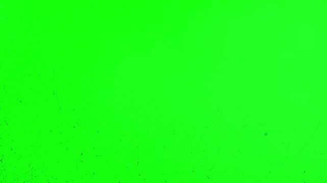 Thick white and pink clouds rolling over a green screen chroma key background