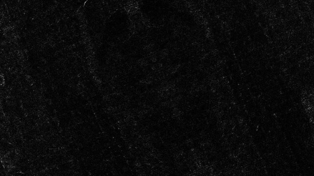 Very dark textured surface with faint grain patterns, subtle speckles, and matte appearance. Grunge texture background animation.