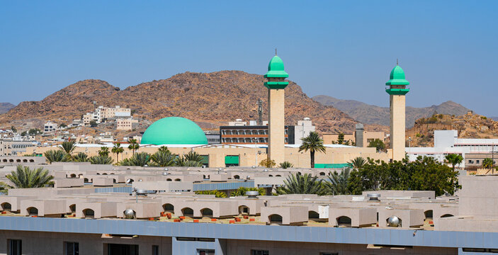 Panoramic view of King Fahd Grand Mosque with its iconic green dome and minarets in Taif, Saudi Arabia
