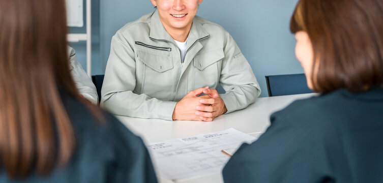 Businessmen in work clothes having a meeting in an office, workplace, or conference room.