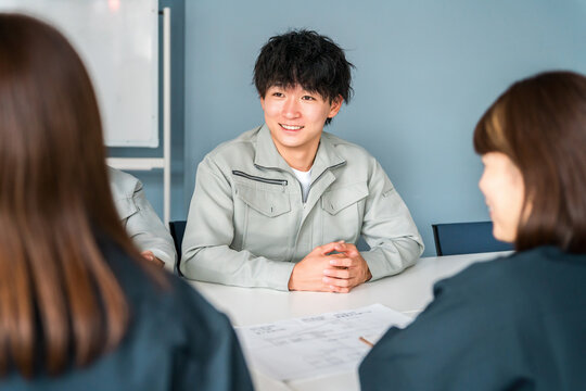 Businessmen in work clothes having a meeting in an office, workplace, or conference room.