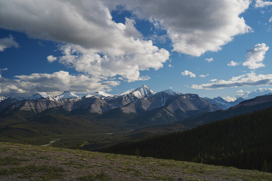 Beautiful views of the Canadian Rockies with picturesque clouds and rivers in the distance 