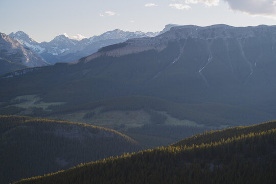 Beautiful views of the Canadian Rockies with picturesque clouds and rivers in the distance 
