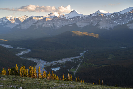 Beautiful views of the Canadian Rockies with picturesque clouds and rivers in the distance 