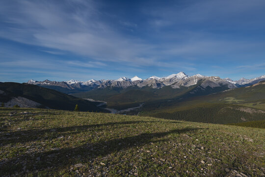 Beautiful views of the Canadian Rockies with picturesque clouds and rivers in the distance 