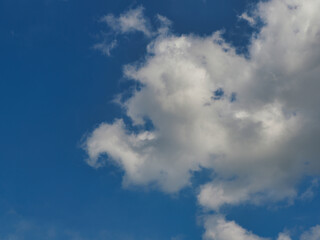 Fototapeta premium Cumulus clouds, or good weather clouds, appear on sunny days and have a soft, cotton-like appearance with a flat base.