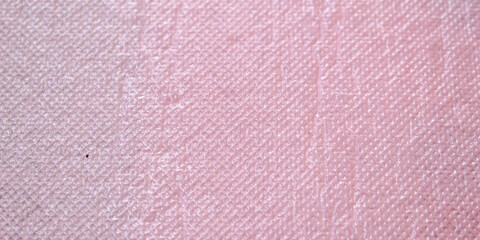 Fototapeta premium The surface texture of the plastic material is pink with a detailed embossed pattern.