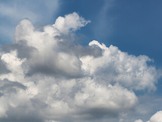 Obraz premium Cumulus clouds, or good weather clouds, appear on sunny days and have a soft, cotton-like appearance with a flat base.