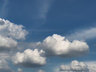 Obraz premium Cumulus clouds, or good weather clouds, appear on sunny days and have a soft, cotton-like appearance with a flat base.