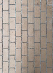 Fototapeta premium Textured beige stone block wall with horizontal joints