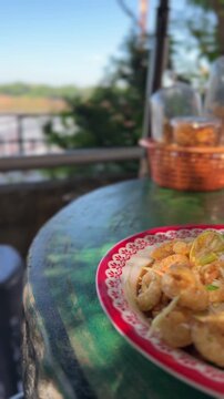Authentic Thai spicy papaya salad with crispy pork cracklings
