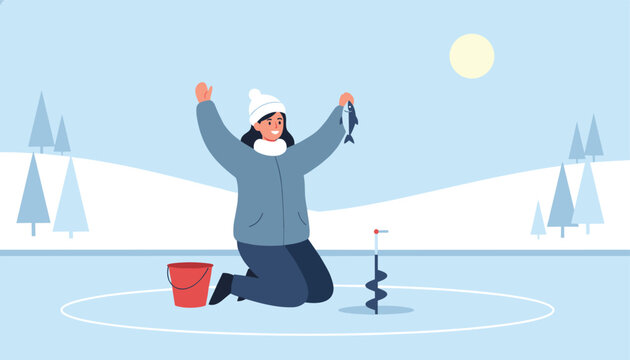 Happy woman kneeling on ice and holding up a freshly caught fish during a successful winter ice fishing trip.