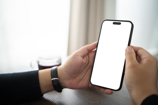 Hands holding a smartphone with a blank white screen, for app mockup, mobile banking, online shopping, or digital technology concept.