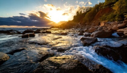 Fototapeta premium Coastal Serenity - Sunlit Waves and Rocky Shoreline at Dusk.